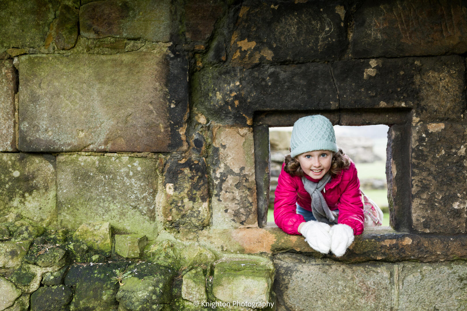 Girl playing peek-a-boo portrait